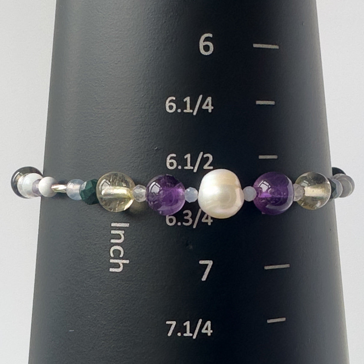 Gemini Birthstone Healing Crystal bracelet for Calm & Anxiety Relief on a mandrel showing a size of 6.5 inches