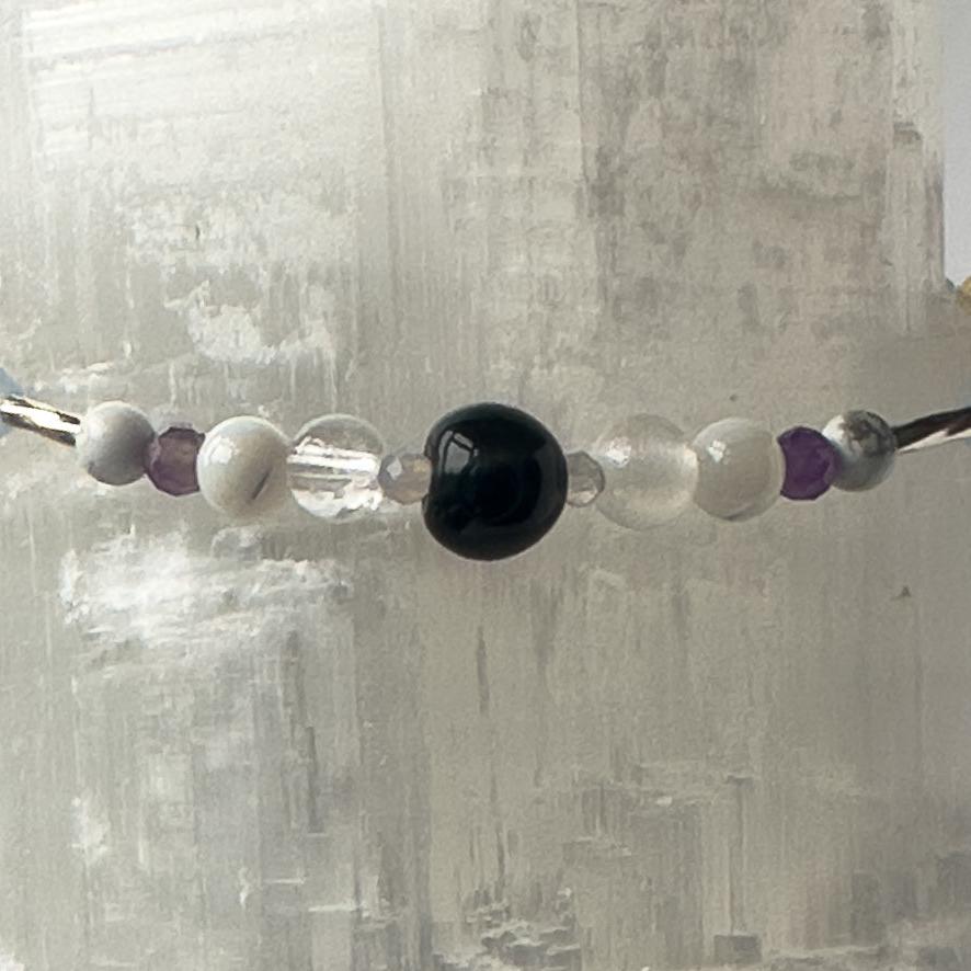 Gemini Birthstone Healing Crystal bracelet for Calm & Anxiety Relief showing Moonstone, Howlite, Blue Tiger’s Eye, Amethyst, Selenite and Clear Quartz