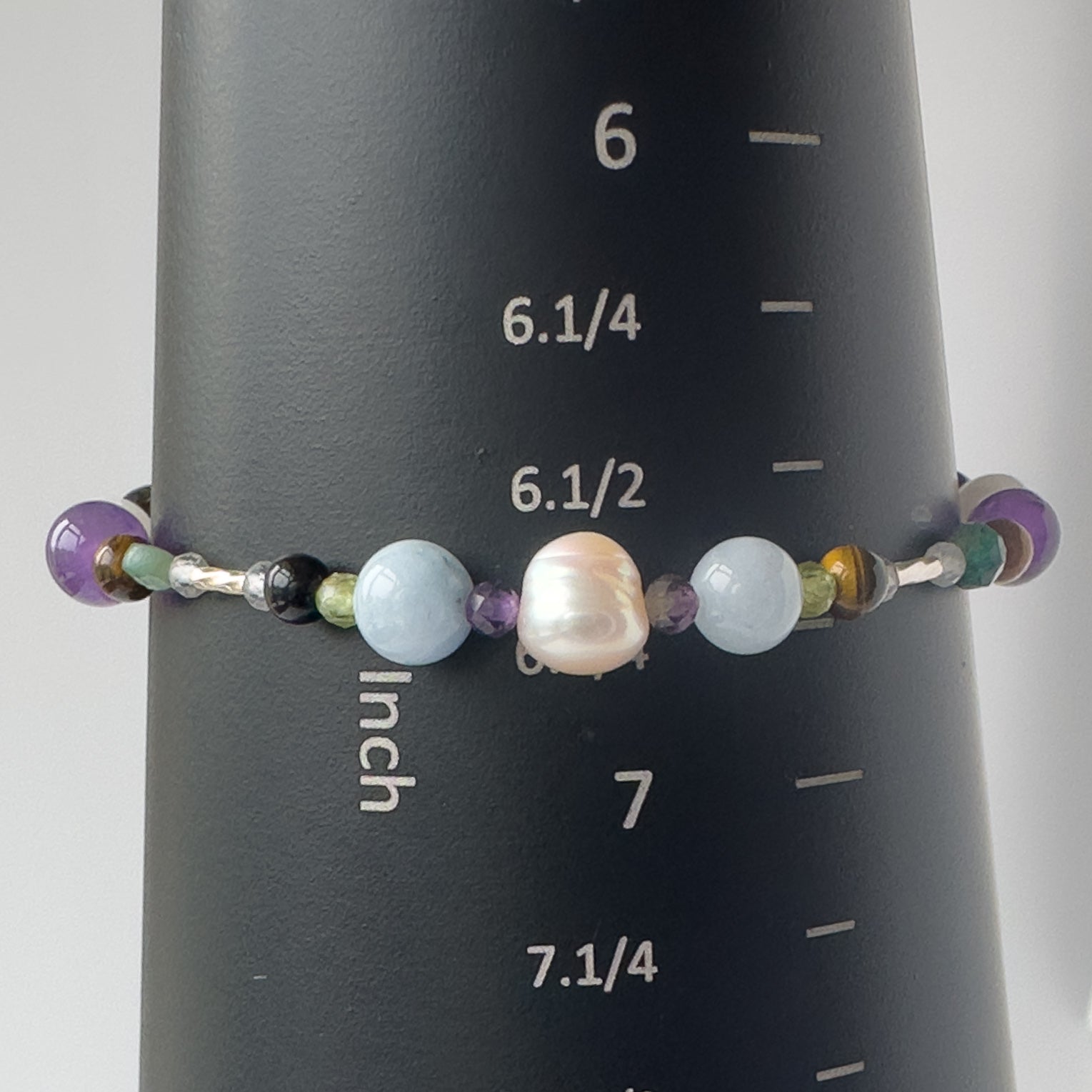 Gemini Birthstone Healing Crystal bracelet for Calm & Stress relief on mandrel showing size of 6.75 inches