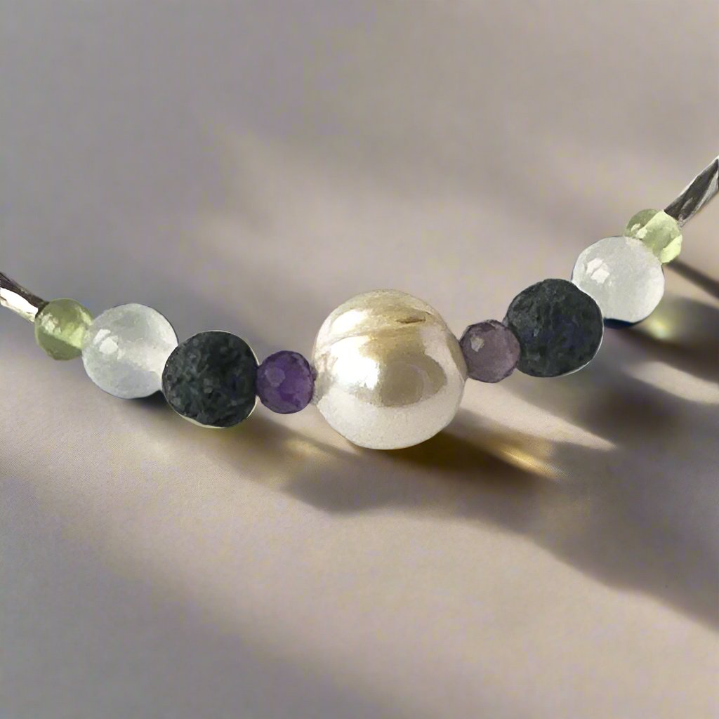 Gemini Birthstone Healing Crystal bracelet for Calm & Stress relief showing Peridot, Pearl, Amethyst, Selenite and Lava Stone