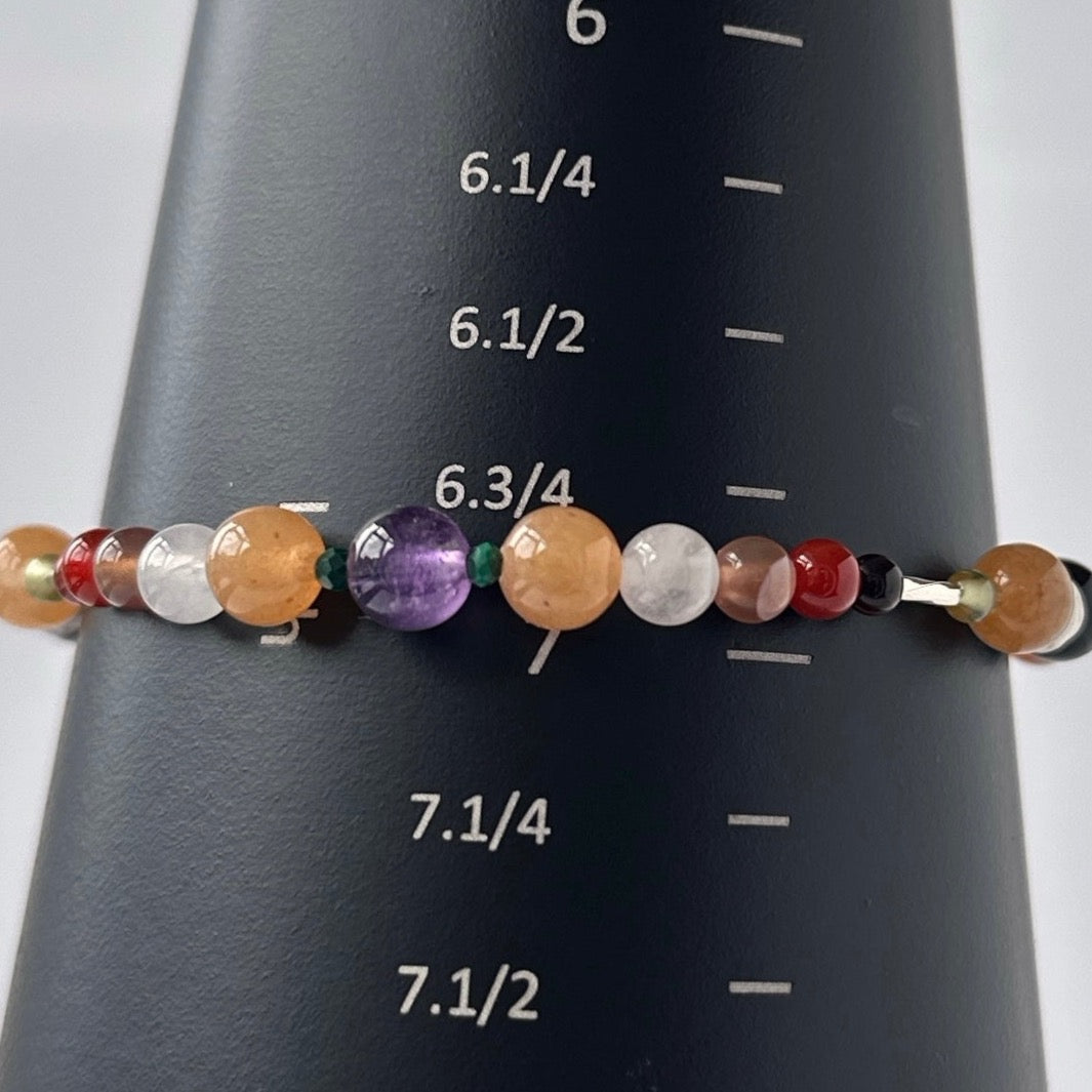 Taurus Handmade Healing Crystal bracelet for Willpower on mandrel showing size as approx 7 inches