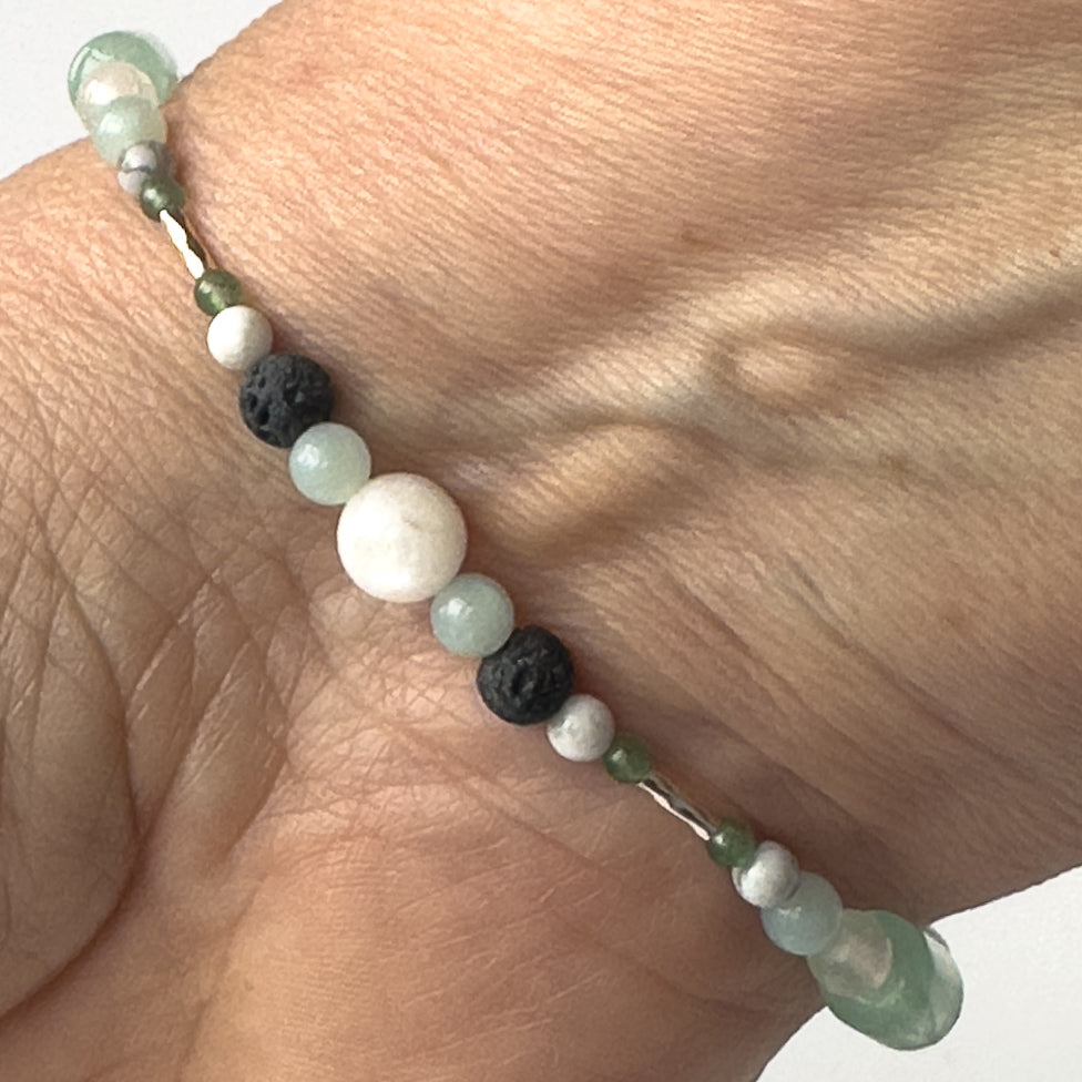 Virgo Healing Crystal bracelet for Anxiety on wrist showing Howlite, Moonstone, Green Aventurine, Amazonite and Lava Stone