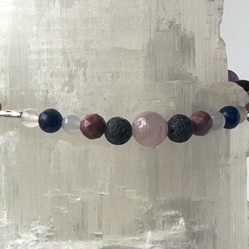 Taurus Healing Crystal bracelet for Anxiety showing Lapis Lazuli, Blue Lace Agate, Rhodonite, Kunzite and Lava Stone