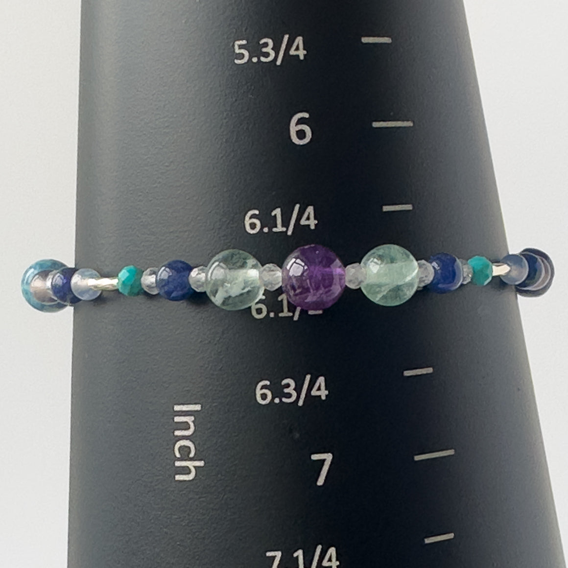 Capricorn Healing Crystal bracelet for Anxiety on mandrel showing size of 6.5 inches 