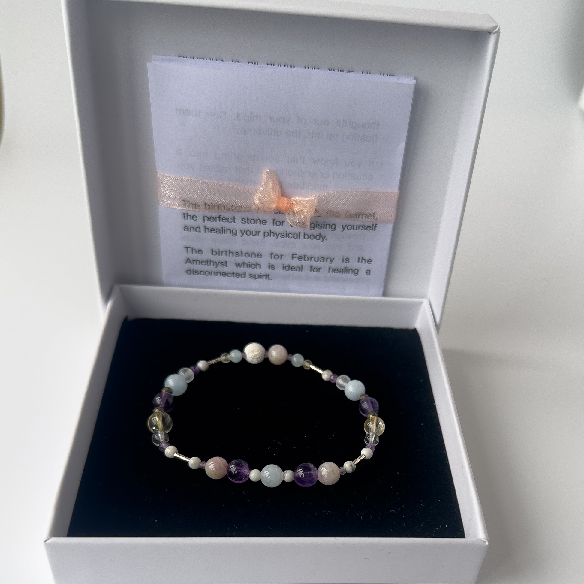 Healing crystal bracelet of Aquamarine, Iron Pyrite, Amethyst, Howlite, Kunzite, Citrine, Selenite, Clear Quartz and Lava Stone in gift box