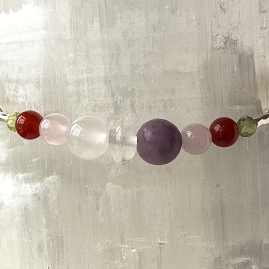 Libra Healing Crystal bracelet for Willpower showing Peridot, Rose Quartz, Lepidolite, Carnelian, Selenite and Clear Quartz