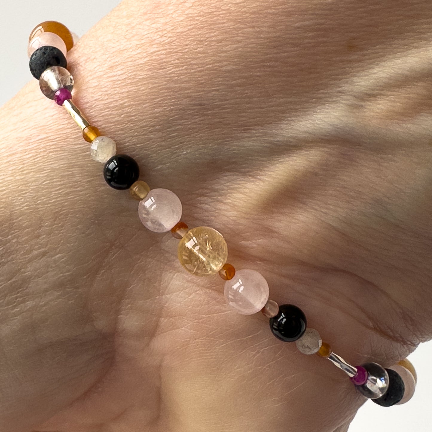 Leo Healing Crystal bracelet for Grief & Loss on wrist showing Black Onyx, Rose Quartz, Carnelian, Citrine and Labradorite