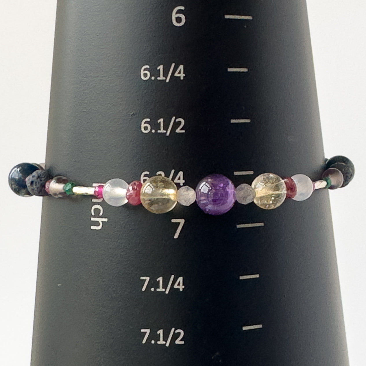 Sagittarius Healing Crystal bracelet for Grief & Loss on mandrel showing size of 6.75 inches