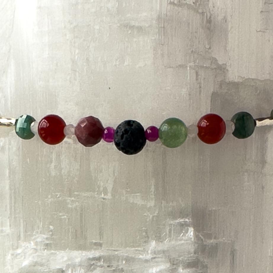 Cancer Healing Crystal bracelet for Grief & Loss showing Ruby, Rhodonite, Carnelian, Chalcedony, Emerald and Lava Stone