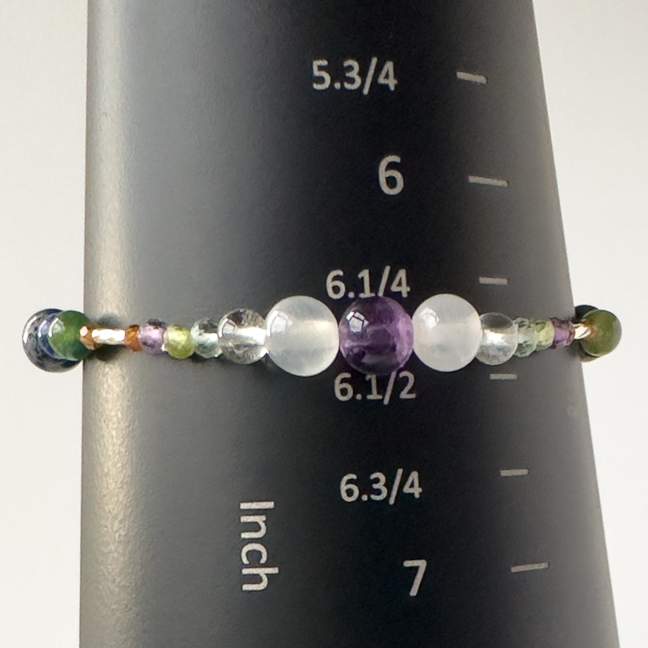 Capricorn Handmade Healing Crystal bracelet for Stress on mandrel showing size as approx 6.5 inches