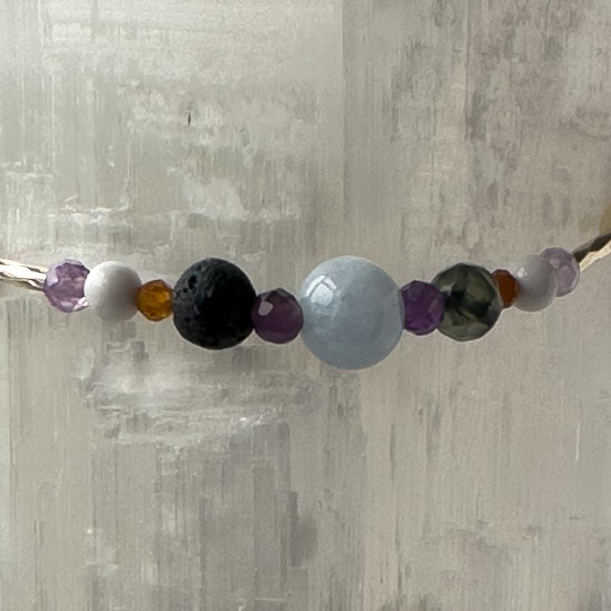 Aries Healing Crystal bracelet for Stress Close-up of Aquamarine, Bloodstone, Amethyst, Howlite, Garnet and Lava Stone