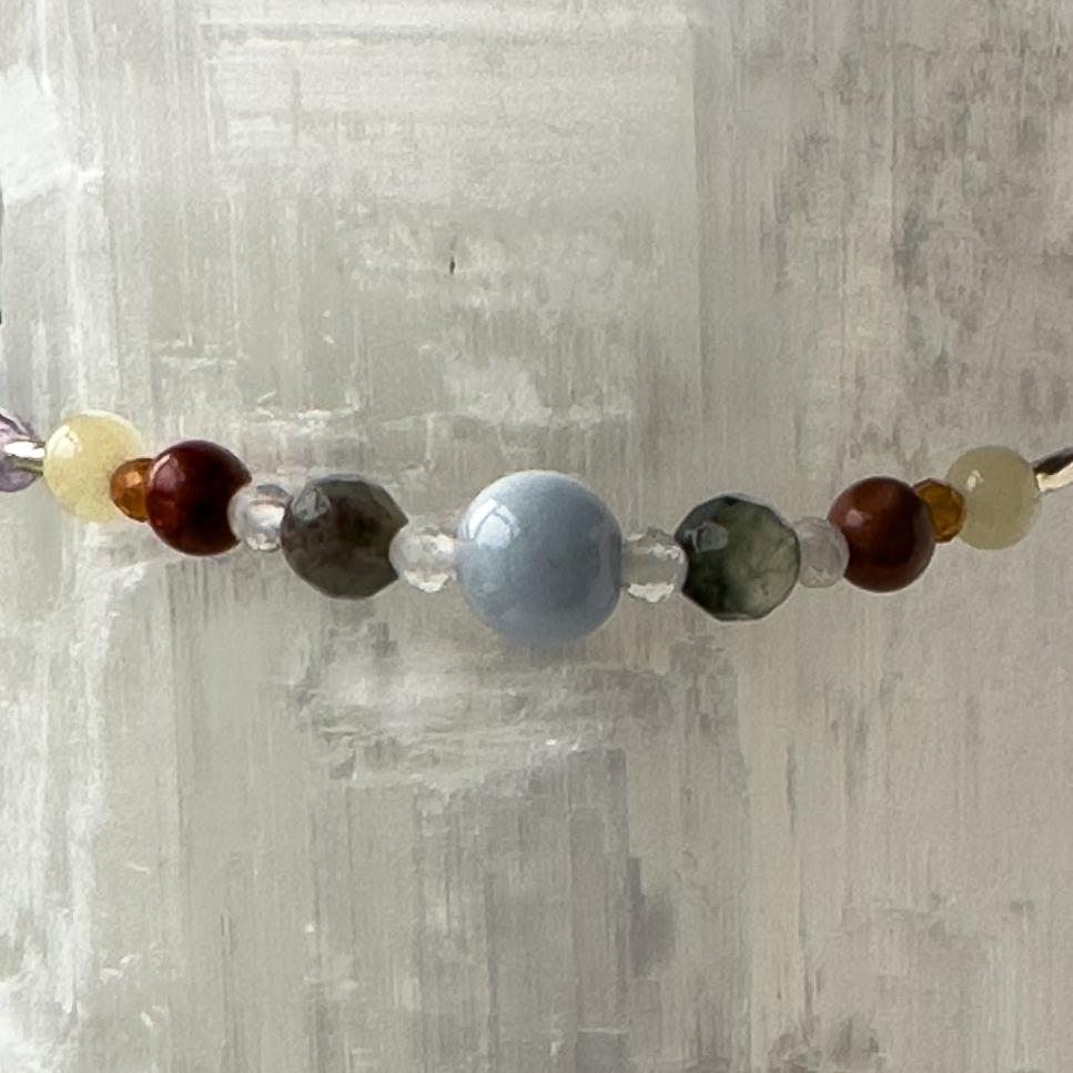 Aries Healing Crystal bracelet for Stress Close-up of Aquamarine, Bloodstone, Red Jasper, Aragonite, Garnet and Clear Quartz