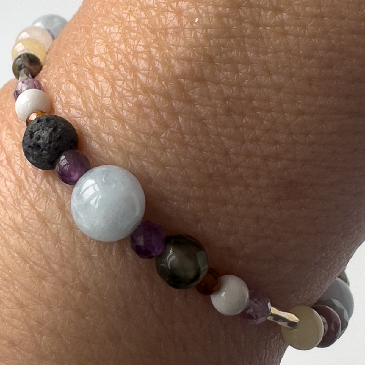 Aries Healing Crystal bracelet for Stress Close-up of Aquamarine, Bloodstone, Amethyst, Howlite, Garnet and Lava Stone