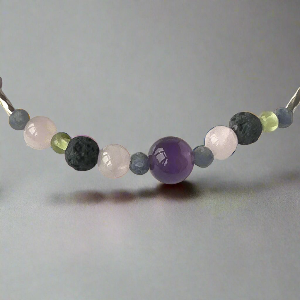 Taurus Healing Crystal bracelet for Stress showing Amethyst, Peridot, Rose Quartz, Sapphire and Lava Stone