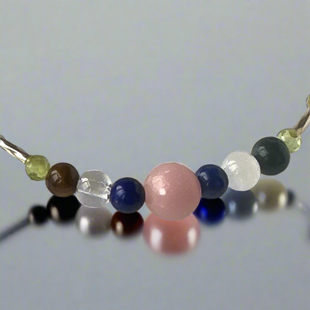 Libra Healing Crystal bracelet for Stress showing Pink Opal, Peridot, Lapis Lazuli, Yellow Tiger’s Eye, Selenite and Clear Quartz