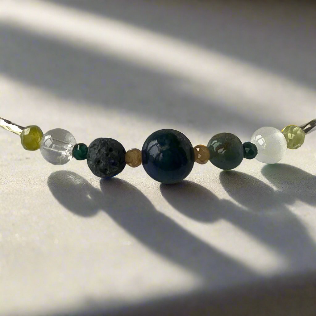 Capricorn Healing Crystal bracelet for Love showing Peridot, Moss Agate, Azurite, Garnet, Malachite, Lava Stone, Selenite and Clear Quartz