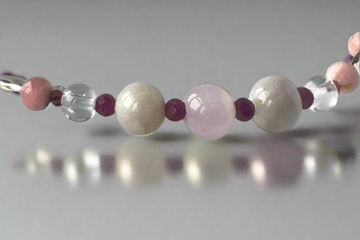 Leo Healing Crystal bracelet for Love showing Rose Quartz, Garnet, Kunzite, Rhodochrosite, Ruby and Clear Quartz