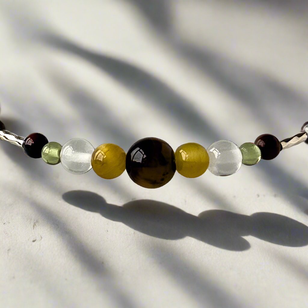 Libra Healing Crystal bracelet for Confidence showing Mahogany Obsidian, Yellow Tiger’s Eye, Selenite and Peridot