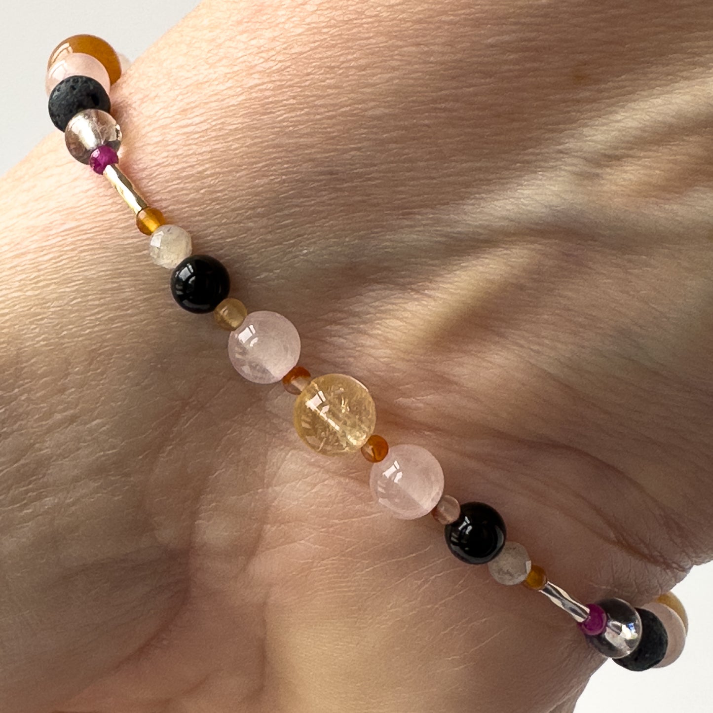 Leo Birthstone Healing Crystal bracelet for Grief & Loss support on wrist showing Black Onyx, Rose Quartz, Carnelian, Citrine and Labradorite