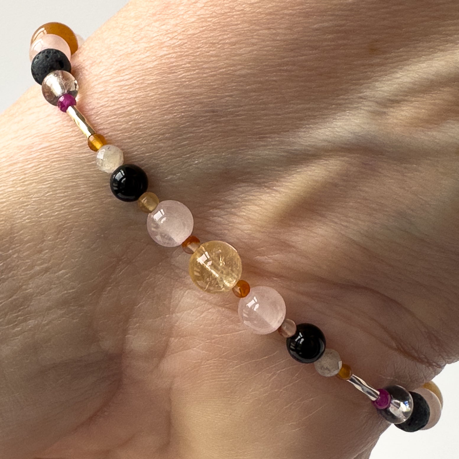 Leo Birthstone Healing Crystal bracelet for Grief & Loss support on wrist showing Black Onyx, Rose Quartz, Carnelian, Citrine and Labradorite