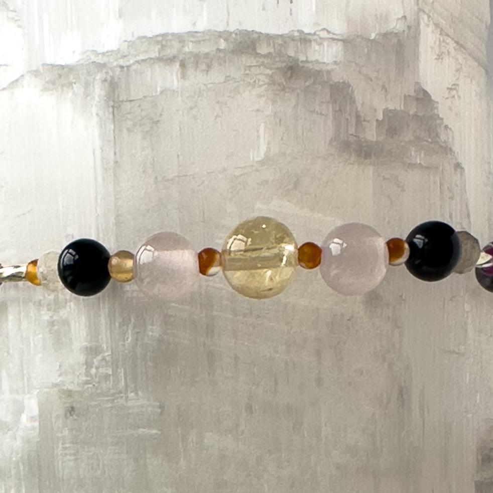 Leo Birthstone Healing Crystal bracelet for Grief & Loss support showing Blue Tiger’s Eye, Black Onyx, Rose Quartz, Carnelian, Citrine and Labradorite