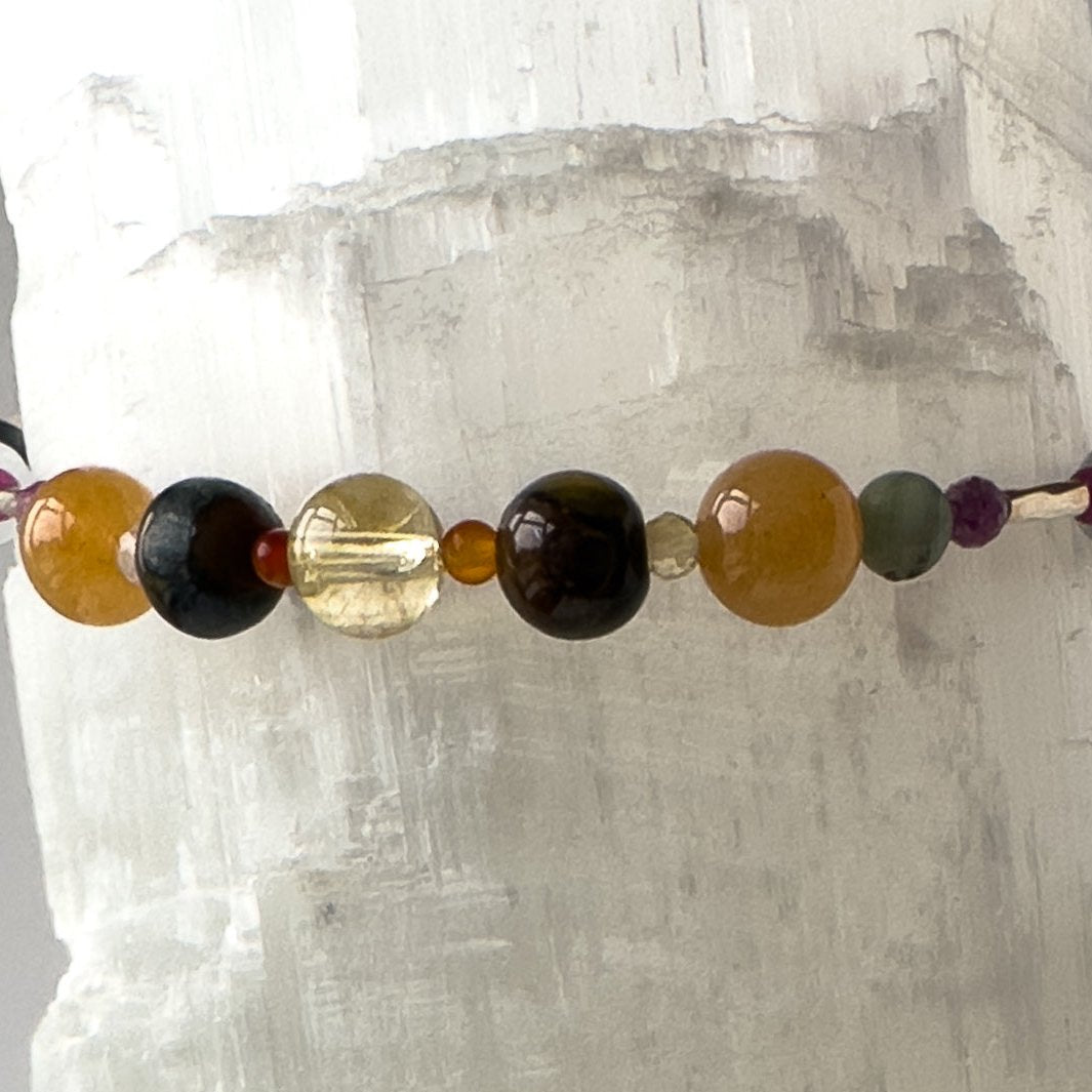 Leo birthstone Healing Crystal bracelet for Grief & Loss support showing Ruby, Blue Tiger’s Eye, Carnelian, Citrine, Emerald and Selenite