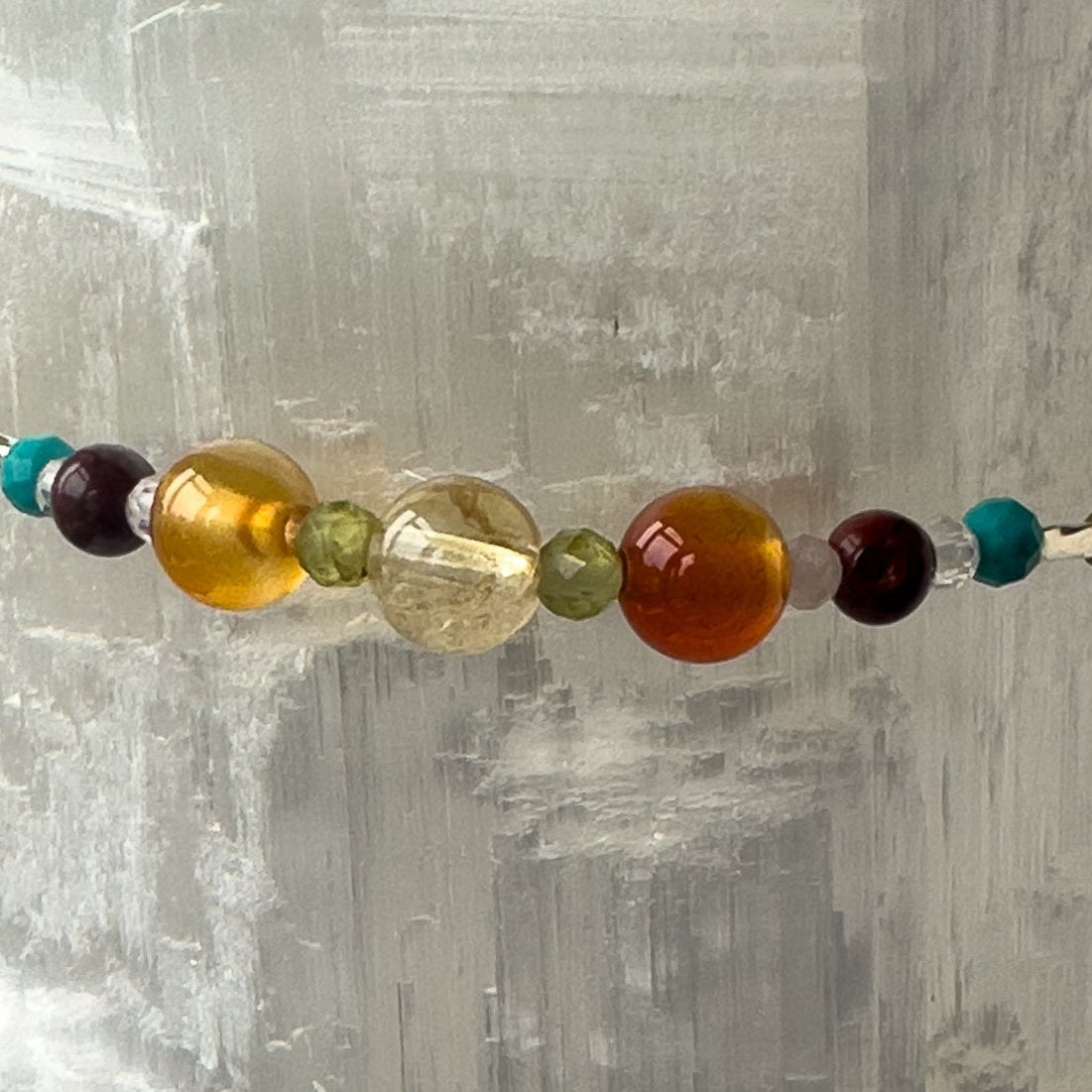 Leo Birthstone Healing Crystal bracelet for Determination & Willpower showing Carnelian, Tiger’s Eye, Peridot, Citrine and Turquoise