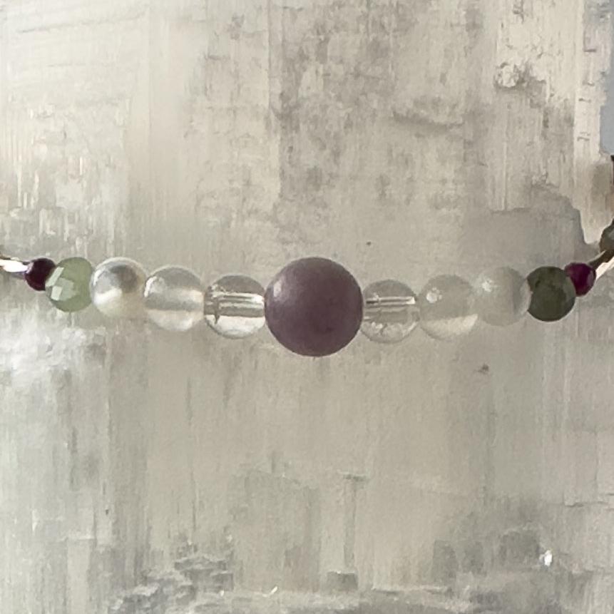 Libra Birthstone Healing Crystal bracelet for Grief & Loss support showing Sugilite, Labradorite, Lepidolite, Moonstone, emerald, Selenite and Clear Quartz