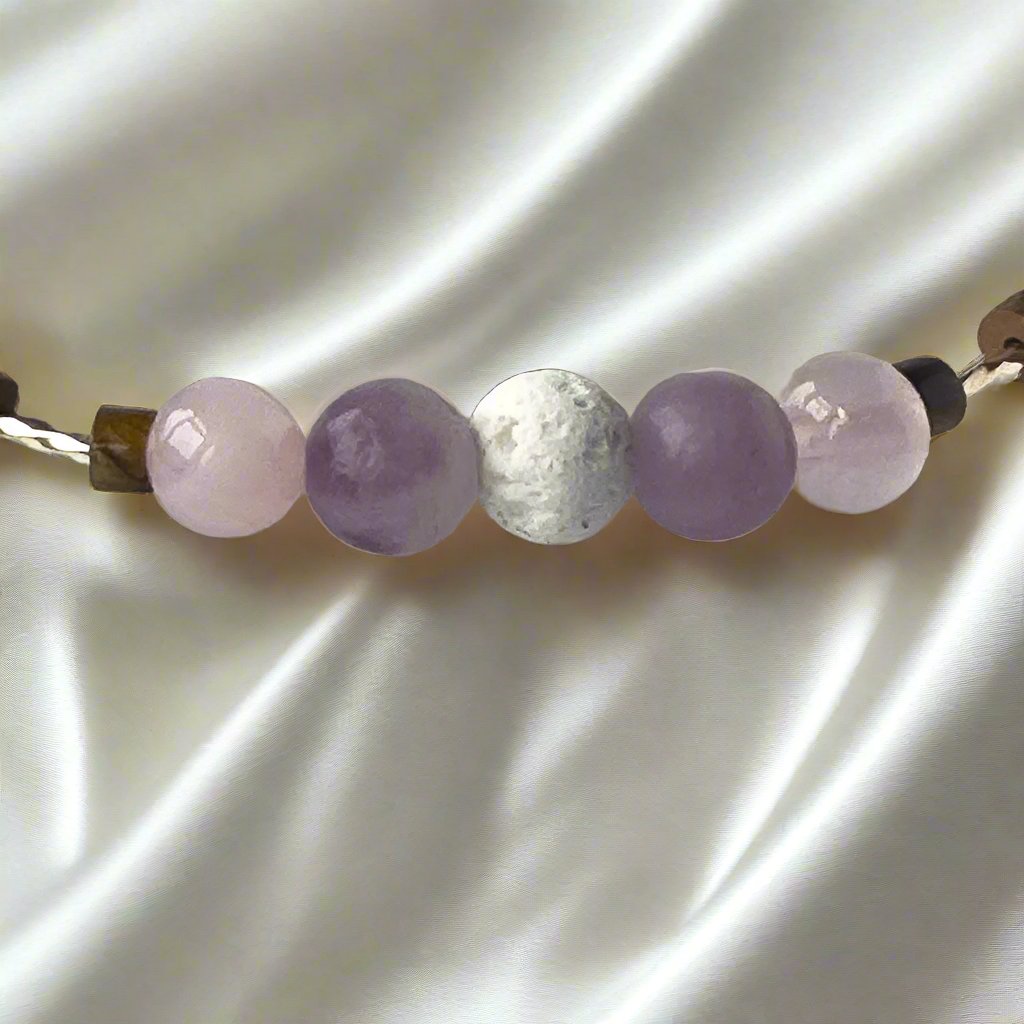 Libra Birthstone Healing Crystal bracelet for Love and Compassion showing Rose Quartz, Lepidolite, Tiger’s Eye and Lava Stone