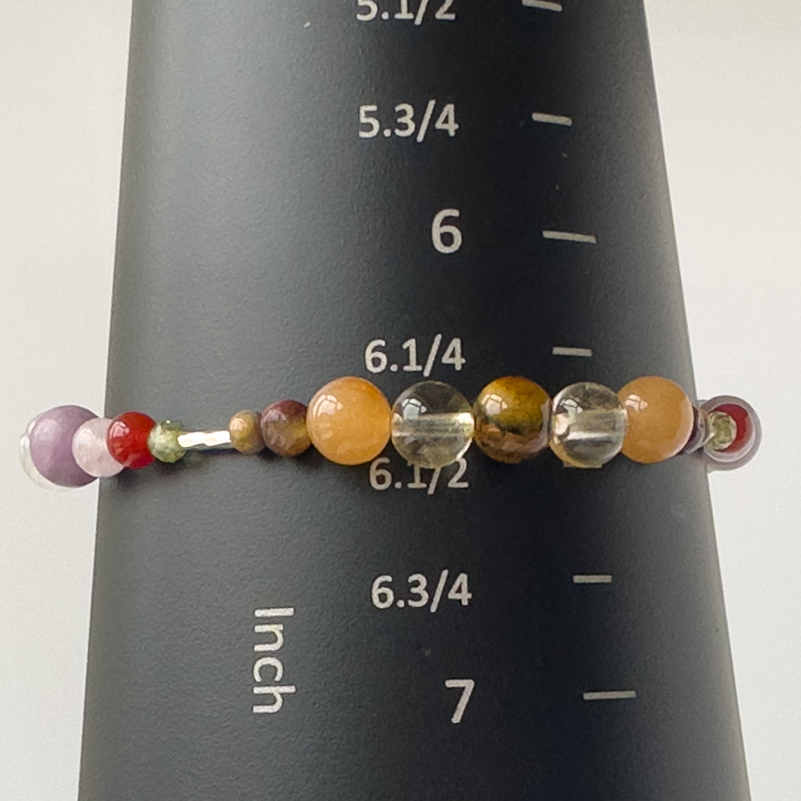 Libra Birthstone Healing Crystal bracelet for Determination & Willpower on mandrel showing size as approx 6.5 inches