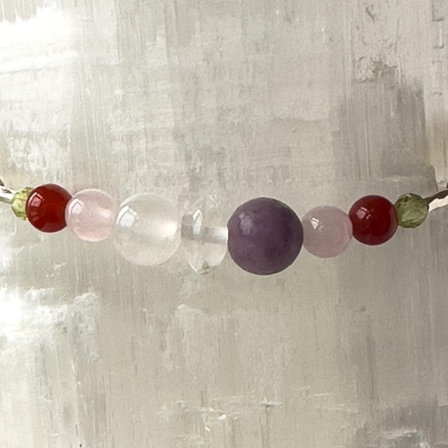 Libra Birthstone Healing Crystal bracelet for Determination & Willpower showing Peridot, Rose Quartz, Lepidolite, Carnelian, Selenite and Clear Quartz