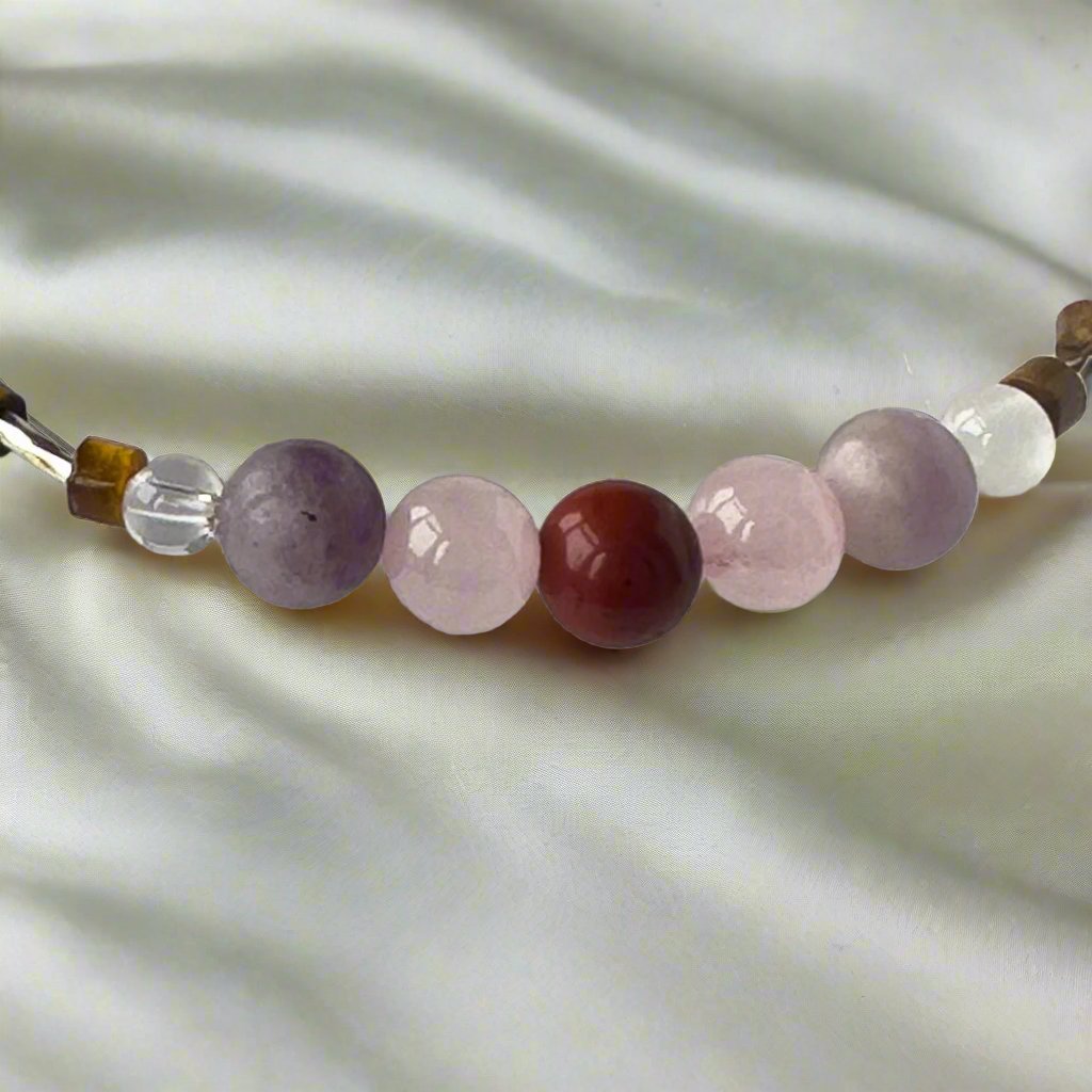 Libra Birthstone Healing Crystal bracelet for Love and Compassion showing Rose Quartz, Red Jasper, Lepidolite, Tiger’s Eye, Selenite and Clear Quartz