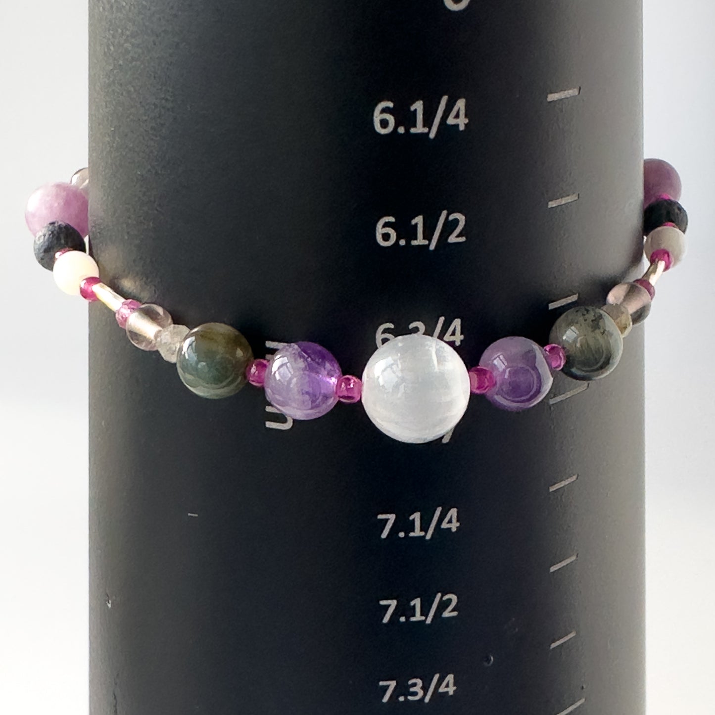 Pisces Birthstone Healing Crystal bracelet for Grief & Loss support on mandrel showing size as 6.75 inches
