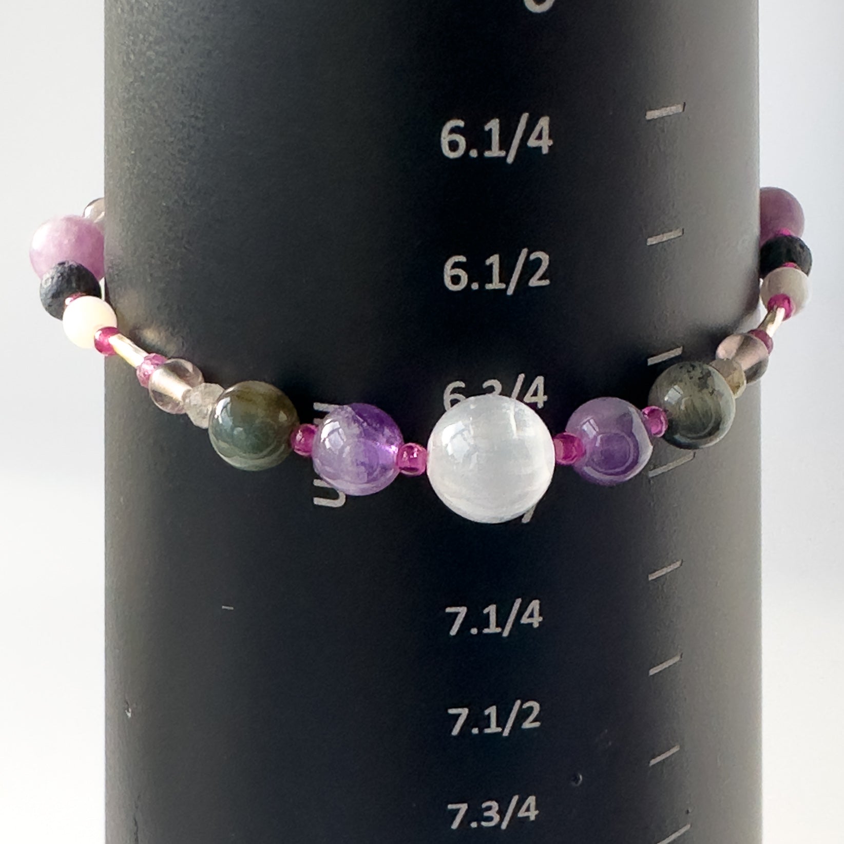 Pisces Birthstone Healing Crystal bracelet for Grief & Loss support on mandrel showing size as 6.75 inches