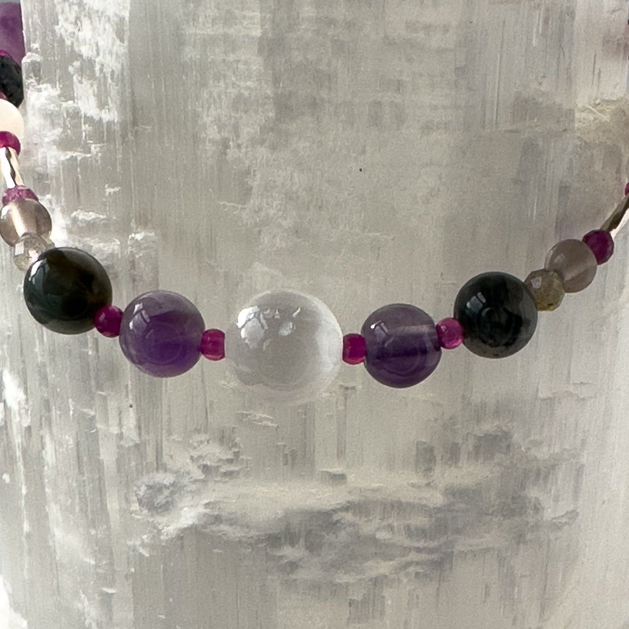Pisces Birthstone Healing Crystal bracelet for Grief & Loss support showing Amethyst, Smoky Quartz, Labradorite, Ruby and Selenite