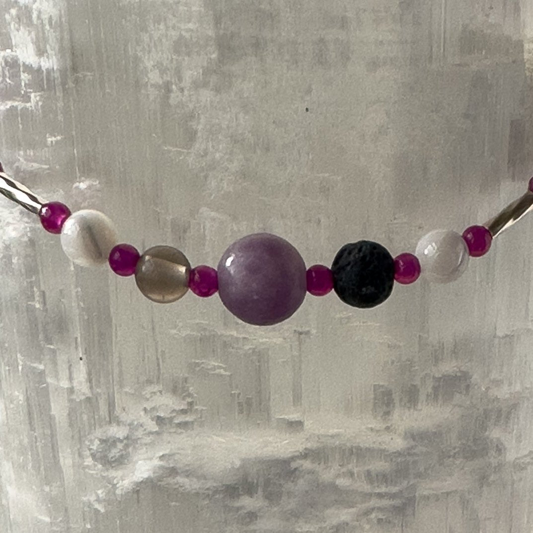 Pisces Birthstone Healing Crystal bracelet for Grief & Loss support showing Lepidolite, Smoky Quartz, Moonstone, Ruby and Lava Stone