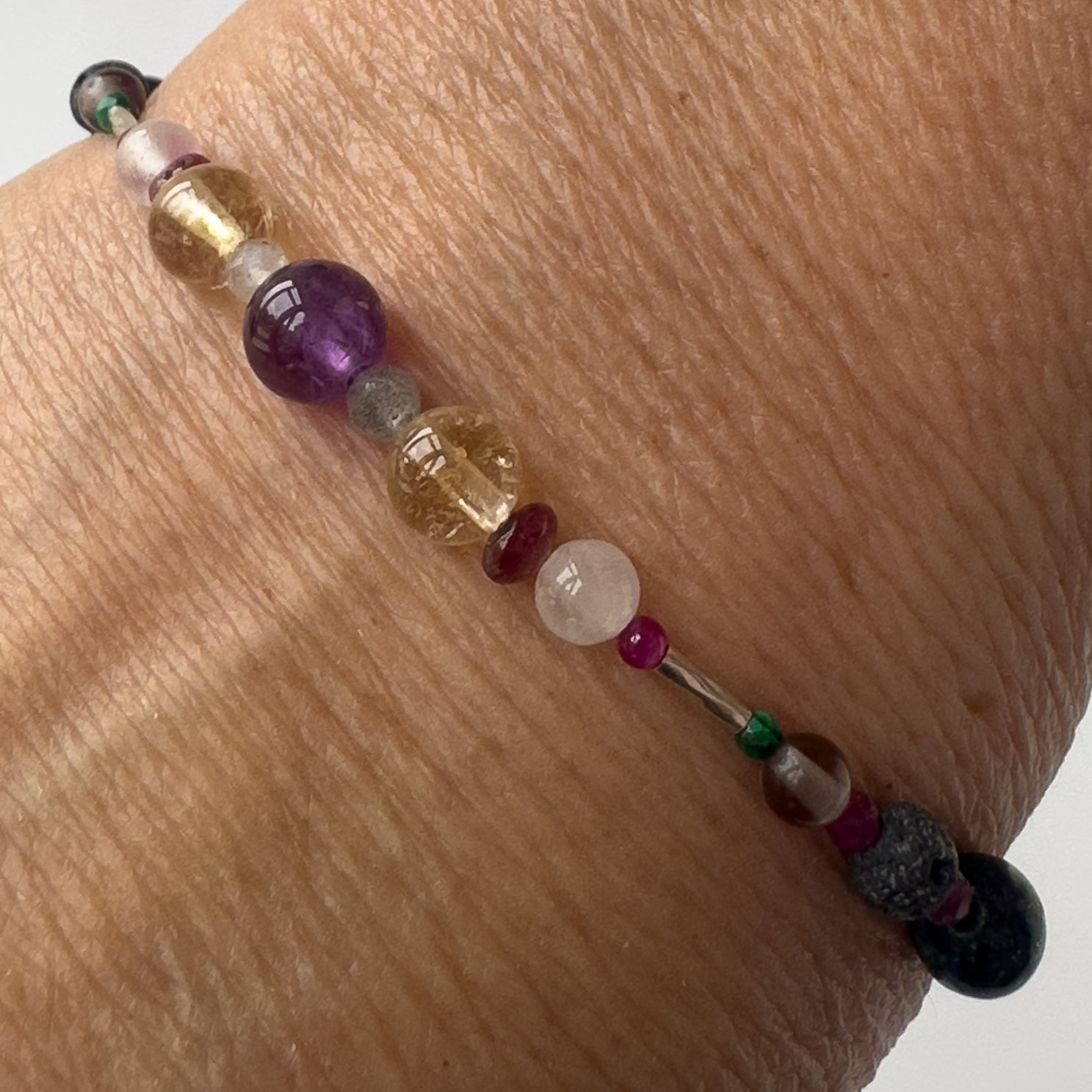 Sagittarius Healing Crystal bracelet for Grief & Loss on wrist showing Citrine, Amethyst, Labradorite, Ruby and Selenite