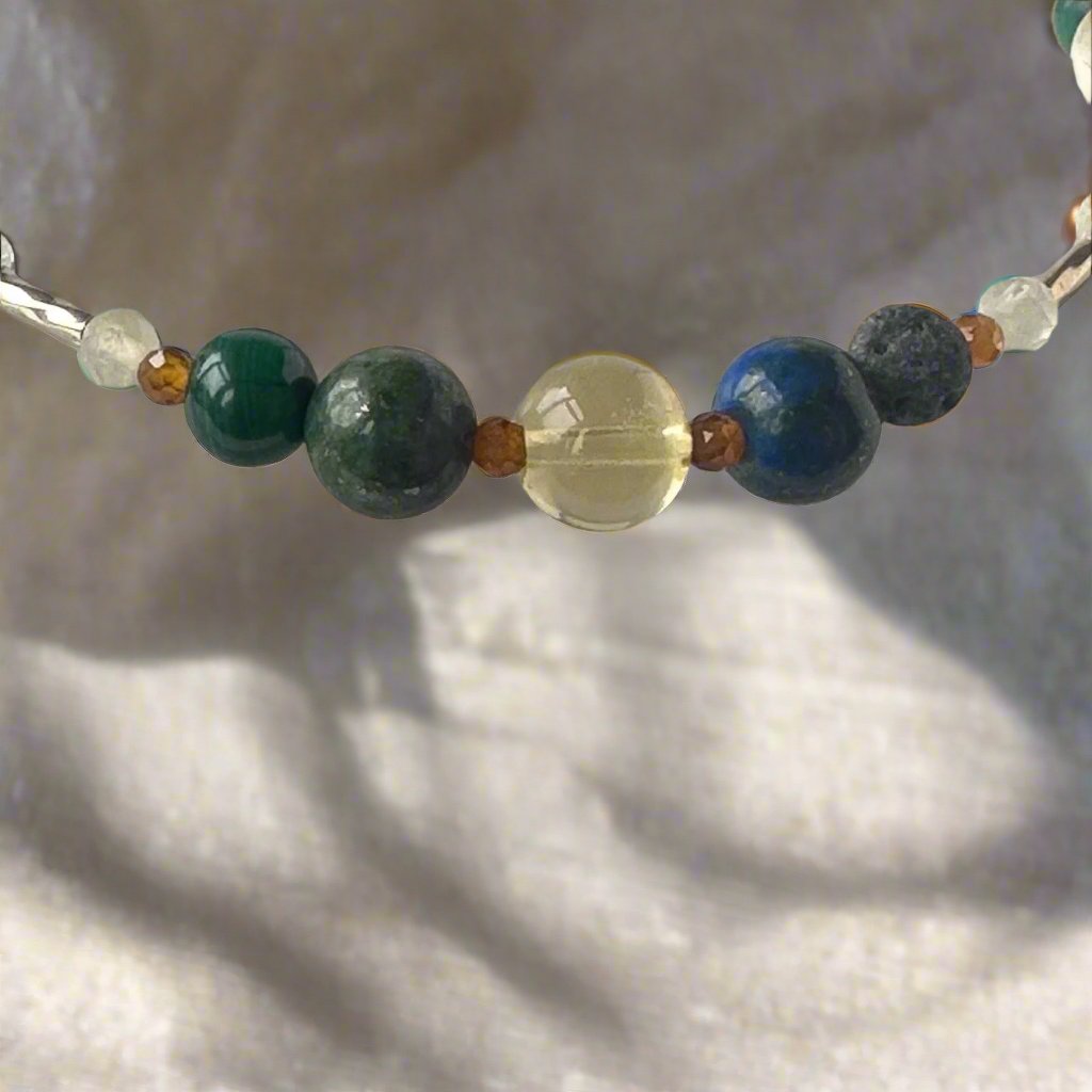 Sagittarius Birthstone Healing Crystal bracelet for Love and Compassion showing Citrine, Azurite, Garnet, malachite, Lava Stone