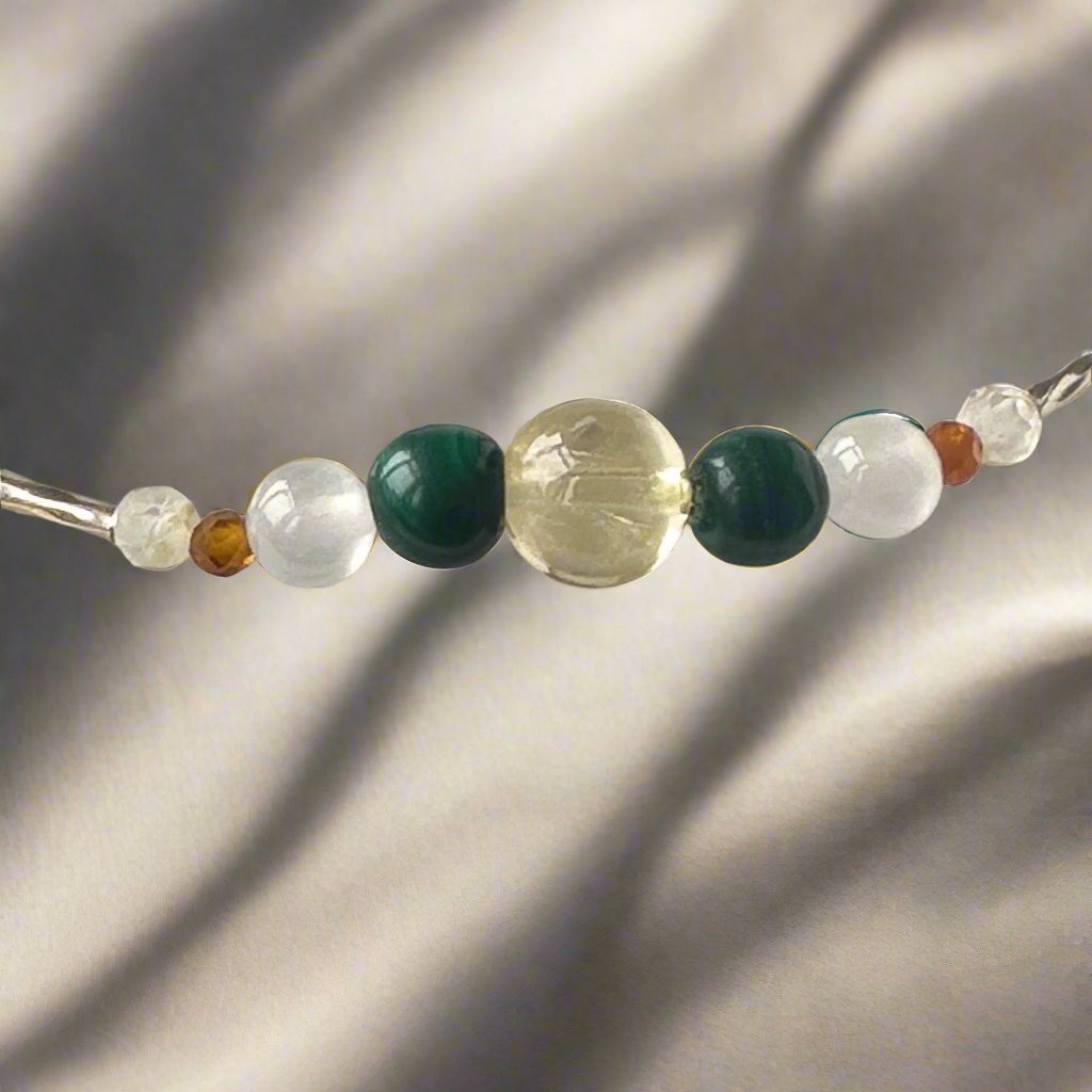 Sagittarius Birthstone Healing Crystal bracelet for Love and Compassion showing Citrine, Garnet, Malachite and Clear Quartz