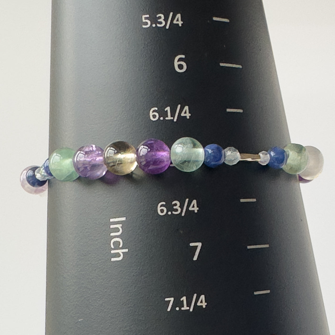Sagittarius Birthstone Healing Crystal bracelet for Determination & Willpower on mandrel showing size as 6.5 inches