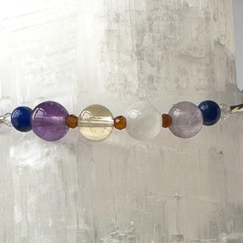 Sagittarius Birthstone Healing Crystal bracelet for Determination & Willpower showing Amethyst, Rainbow Fluorite, Citrine, Sodalite, Garnet and Selenite