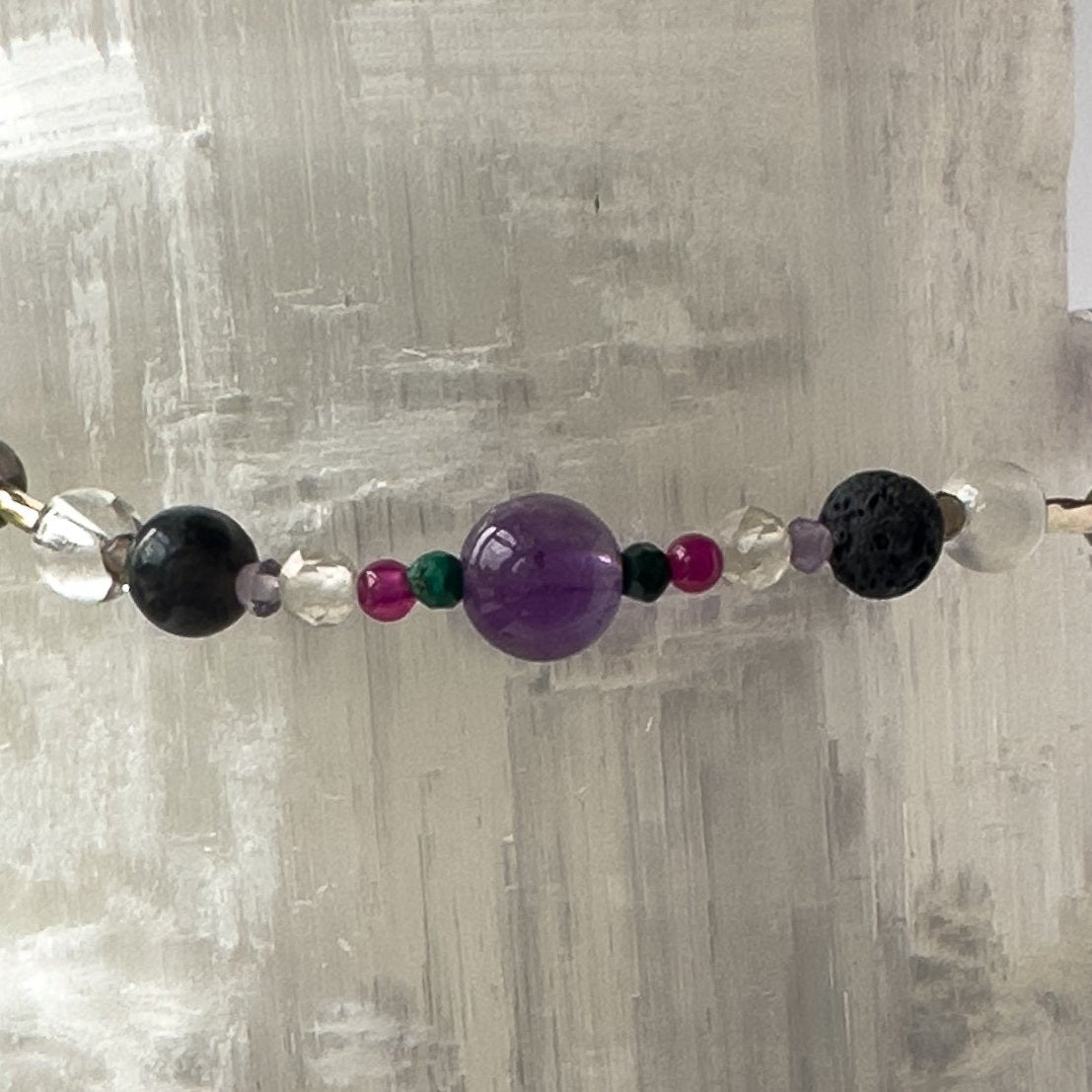 Scorpio Birthstone Healing Crystal bracelet for Grief & Loss support showing Citrine, Malachite, Ruby, Amethyst, Smoky Quartz, Selenite, Clear Quartz and Lava Stone