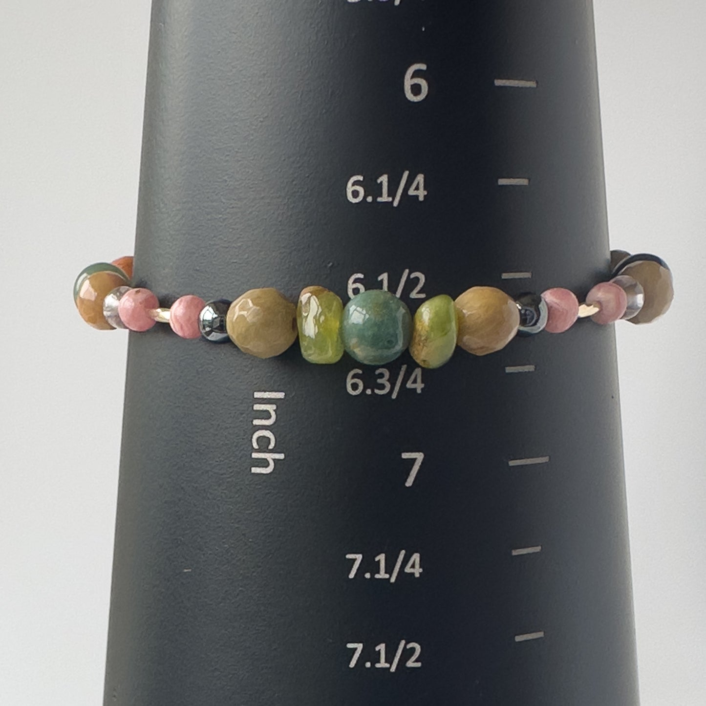 Scorpio birthstone Healing Crystal bracelet for Love and Compassion on mandrel showing size as approx 6.5 inches