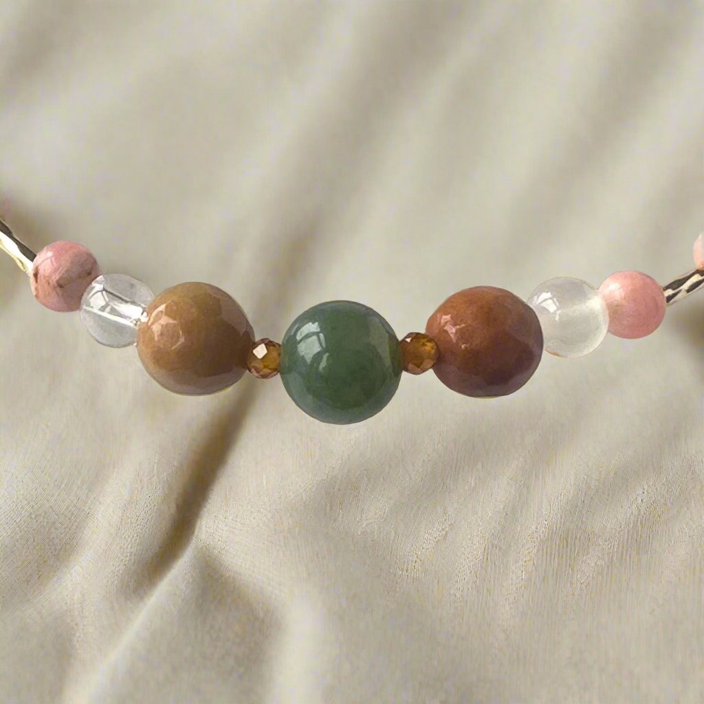 Scorpio Birthstone Healing Crystal bracelet for Love and Compassion showing Moss Agate, Garnet, Rhodochrosite, Rhodonite, Selenite and Clear Quartz