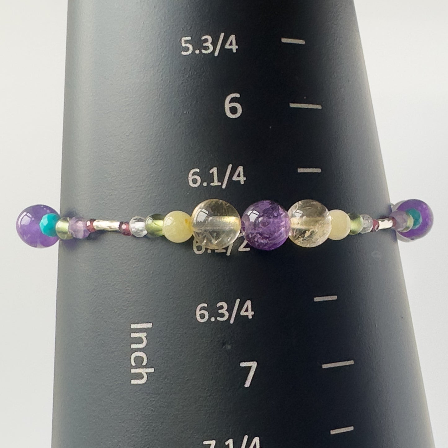 Scorpio Birthstone Healing Crystal bracelet for Determination & Willpower on mandrel showing size as 6.5 inches
