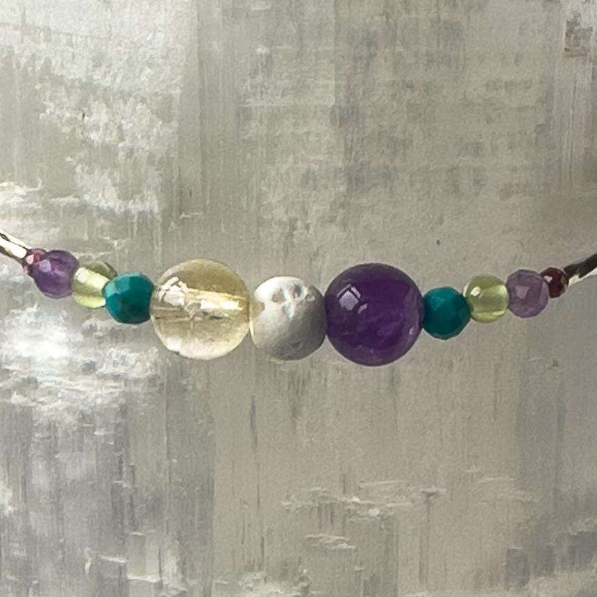 Scorpio Birthstone Healing Crystal bracelet for Determination & Willpower showing Amethyst, Citrine, Turquoise, Peridot and Lava Stone