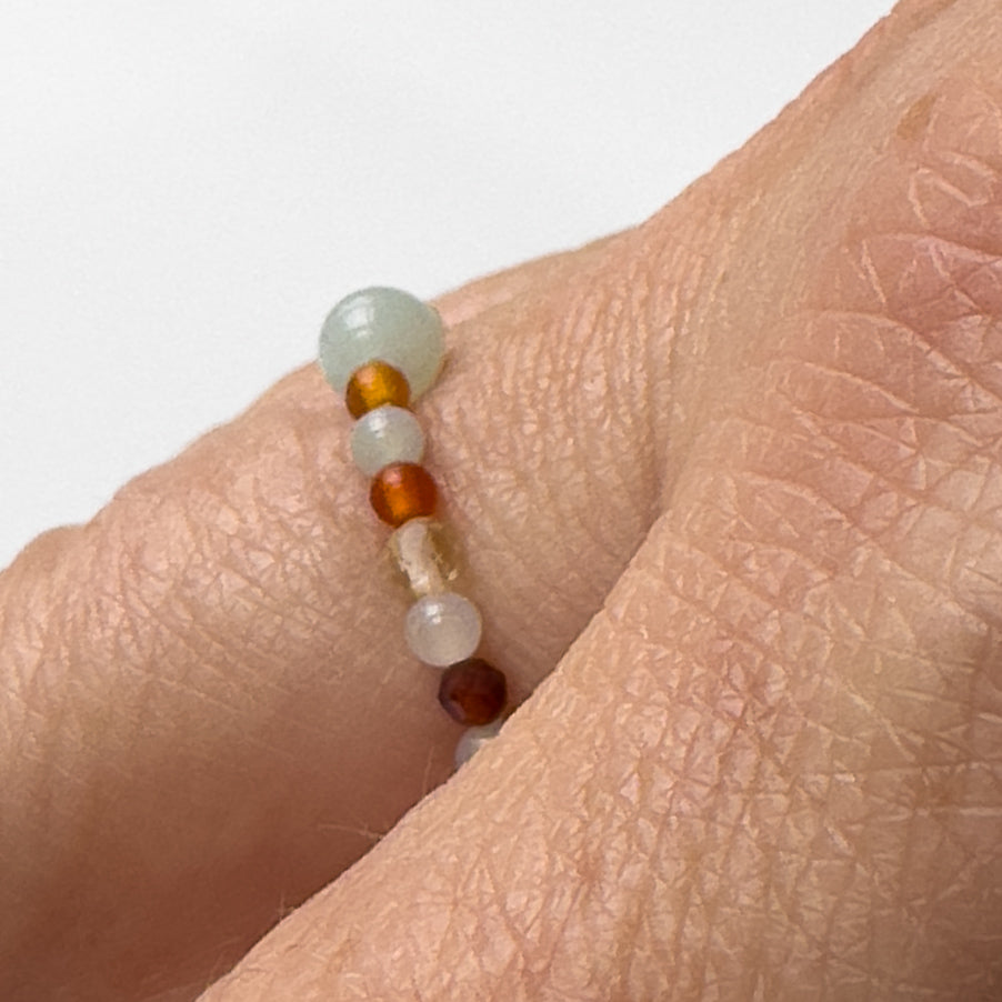 Side view of Virgo Birthstone Healing Crystal ring for Strength and Courage on finger