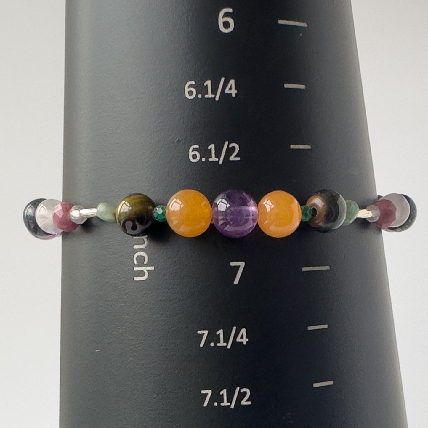 Taurus Birthstone Healing Crystal bracelet for Grief & Loss on mandrel showing size of 6.75 inches