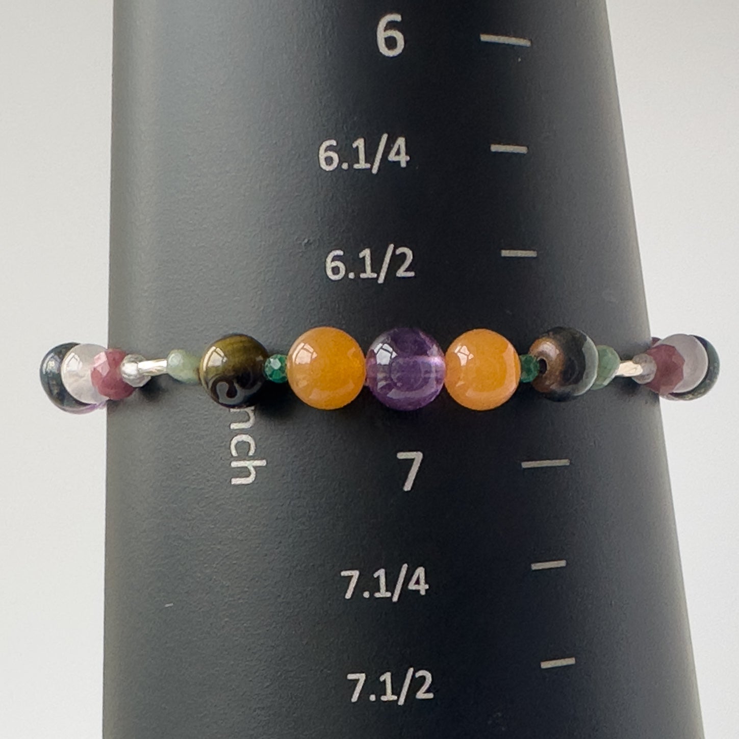 Taurus Birthstone Healing Crystal bracelet for Grief & Loss on mandrel showing size of 6.75 inches