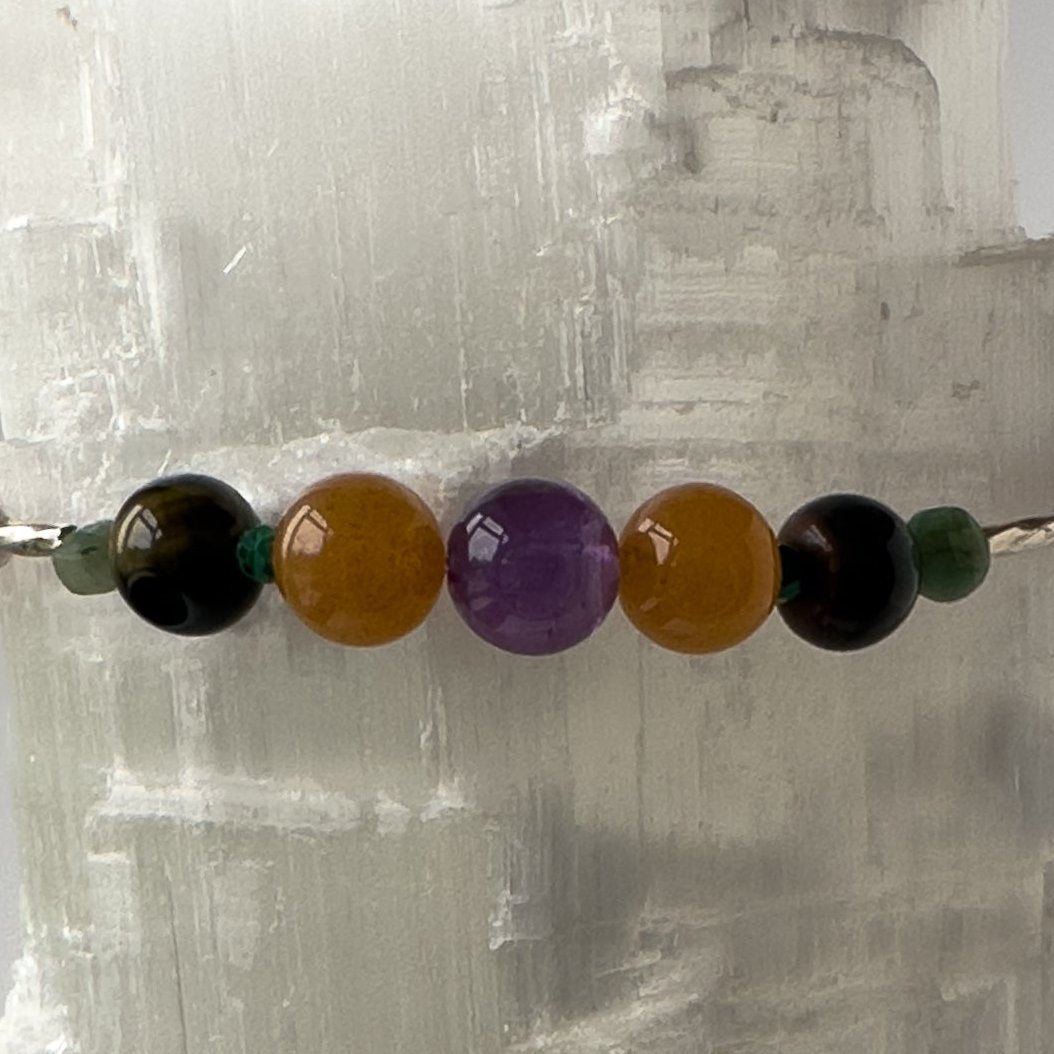 Taurus Birthstone Healing Crystal bracelet for Grief & Loss support showing Emerald, Amethyst, Carnelian, Blue Tiger’s Eye